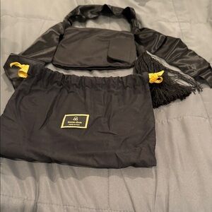 Bienan Davis black satin wristlet never worn.